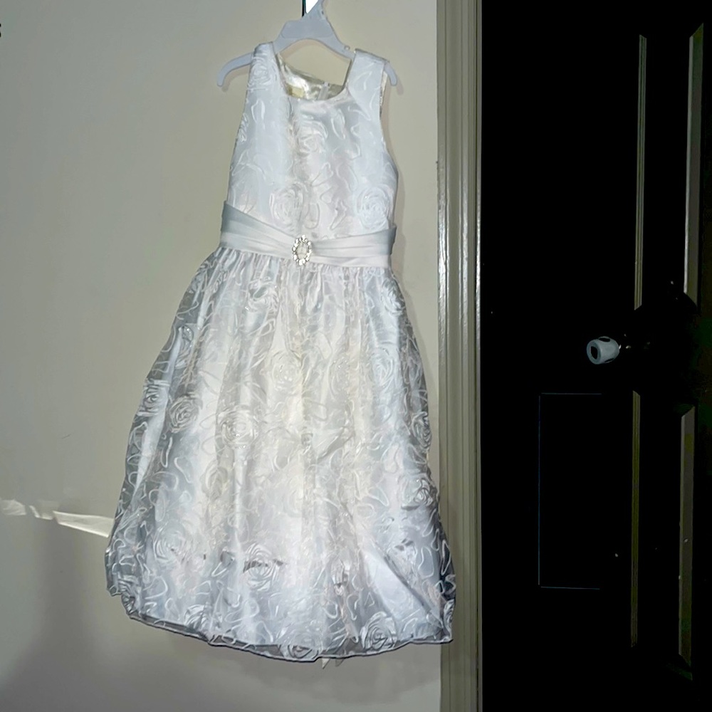 A very pretty white dress and with flower designed all around